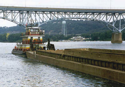 a boat pushing a barge