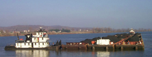 test barge being pushed by a boat